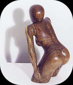 Watching and Waiting - walnut figurative sculpture by Christopher Rebele