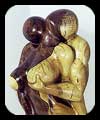 Consent - walnut figurative sculpture by Christopher Rebele