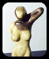 Morning Stretch - walnut figurative sculpture by Christopher Rebele