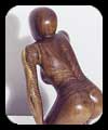 Watching and Waiting - walnut figurative sculpture by Christopher Rebele